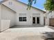 Spacious backyard patio area with a neutral-colored stucco exterior and ample sunlight at 8084 Black Orchid Ave, Las Vegas, NV 89131