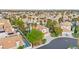 Aerial view of community with a lush landscape, tile roofs, and views of the Las Vegas skyline at 8117 Horizon Lake Dr, Las Vegas, NV 89128