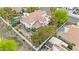 Aerial view of a home with a backyard pool, fire pit, mature palms, and tiled roof at 8117 Horizon Lake Dr, Las Vegas, NV 89128