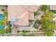 Aerial view of a home with a tiled roof, pool, patio, and an outdoor fire pit at 8117 Horizon Lake Dr, Las Vegas, NV 89128