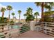 Balcony view of the pool and palm trees at 8117 Horizon Lake Dr, Las Vegas, NV 89128