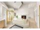 Luxurious bathroom with a built-in tub, walk-in shower, and a cozy fireplace at 8117 Horizon Lake Dr, Las Vegas, NV 89128