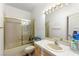 Bright bathroom featuring a tiled shower, toilet, and single sink vanity at 8117 Horizon Lake Dr, Las Vegas, NV 89128
