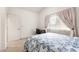 Bright bedroom features a comfortable bed and a window with sheer curtains at 8117 Horizon Lake Dr, Las Vegas, NV 89128
