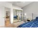 Bedroom featuring a bed with a patterned comforter and mirrored closet at 8117 Horizon Lake Dr, Las Vegas, NV 89128
