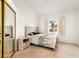 Well-lit bedroom featuring a comfortable bed, closet, and simple furnishings at 8117 Horizon Lake Dr, Las Vegas, NV 89128