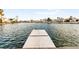Picturesque view of a lake with a dock and waterfront homes at 8117 Horizon Lake Dr, Las Vegas, NV 89128