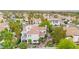 An aerial view showcases this home's red tile roof, backyard patio and lush landscaping, offering an inviting outdoor living space at 8117 Horizon Lake Dr, Las Vegas, NV 89128