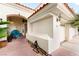 Home exterior featuring a covered entrance, an address number, and a three-car garage at 8117 Horizon Lake Dr, Las Vegas, NV 89128