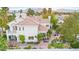 Aerial view of a well-maintained two-story home with a red tile roof and desert landscaping at 8117 Horizon Lake Dr, Las Vegas, NV 89128