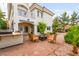 Back of the house showing the outdoor patio with a built-in grill and a fire pit at 8117 Horizon Lake Dr, Las Vegas, NV 89128