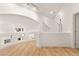 Bright, open hallway featuring white walls and wood floors at 8117 Horizon Lake Dr, Las Vegas, NV 89128