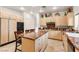Well-lit kitchen with wooden cabinets, granite countertops, and modern appliances at 8117 Horizon Lake Dr, Las Vegas, NV 89128