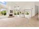 Bright living room boasts a fireplace, a large carpeted sitting area, and big windows at 8117 Horizon Lake Dr, Las Vegas, NV 89128