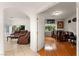 Open-concept living space with hardwood and tile floors, bright windows, and comfortable seating at 8117 Horizon Lake Dr, Las Vegas, NV 89128