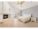 Bright Primary bedroom with a fireplace and private balcony entrance at 8117 Horizon Lake Dr, Las Vegas, NV 89128