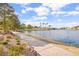 Picturesque walking path near the tranquil lake with lush landscaping at 8117 Horizon Lake Dr, Las Vegas, NV 89128