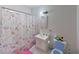 Bathroom with a floral shower curtain and a white vanity at 833 Bruce St, Las Vegas, NV 89101