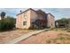 Two story home with a walkway and stairwell on the side of the home at 833 Bruce St, Las Vegas, NV 89101