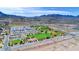 Aerial view showcasing the school with sports fields, walking trails, and ample parking at 902 Little Raven St, Henderson, NV 89002