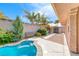 Relaxing backyard features a refreshing pool, mature trees, and convenient storage shed at 902 Little Raven St, Henderson, NV 89002