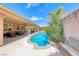 This backyard features a covered patio and a private pool, perfect for outdoor entertainment at 902 Little Raven St, Henderson, NV 89002