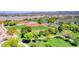 A vibrant park scene featuring well-maintained baseball fields, lush greenery, and walking paths at 902 Little Raven St, Henderson, NV 89002