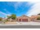 Charming single-story home with a well-manicured front yard and a three-car garage in a quiet neighborhood at 902 Little Raven St, Henderson, NV 89002