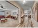 Hallway showcasing the home's layout, connecting the living room and dining area with stylish hardwood floors at 902 Little Raven St, Henderson, NV 89002