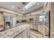 Modern kitchen with granite countertops, stainless steel appliances, and abundant storage at 902 Little Raven St, Henderson, NV 89002