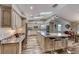 Spacious kitchen featuring a large island, granite countertops, and modern appliances at 902 Little Raven St, Henderson, NV 89002