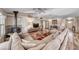 Comfortable living room with a wood-burning fireplace, plush seating, and hardwood floors, perfect for relaxing at 902 Little Raven St, Henderson, NV 89002