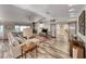Bright and airy living room with a fireplace, hardwood floors, and large windows, creating a welcoming atmosphere at 902 Little Raven St, Henderson, NV 89002