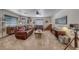 Comfortable living room with a leather sofa, ceiling fan, and a window for natural light at 902 Little Raven St, Henderson, NV 89002