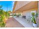 Back patio with dining area and views of the pool and backyard landscaping at 902 Little Raven St, Henderson, NV 89002