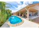 Inviting backyard featuring a private pool, covered patio, and lush landscaping, perfect for outdoor entertaining at 902 Little Raven St, Henderson, NV 89002