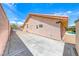 Expansive side yard with concrete slab, leading to the backyard, offering ample space for potential projects at 902 Little Raven St, Henderson, NV 89002