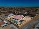 Aerial view of a home featuring a pool, an outdoor kitchen, and a fully enclosed yard in a residential neighborhood at 9091 Becket Ranch Ct, Las Vegas, NV 89113