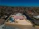 Desert landscaped property with a pool boasts beautiful mountain views in the distance at 9091 Becket Ranch Ct, Las Vegas, NV 89113
