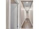 Hallway featuring luxury vinyl plank flooring, neutral walls, and bright white trim and doors at 9091 Becket Ranch Ct, Las Vegas, NV 89113