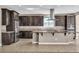 Gourmet kitchen featuring stainless steel appliances, granite countertops, and a center island with bar seating at 9091 Becket Ranch Ct, Las Vegas, NV 89113