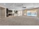Large living room with an open layout, sliding doors to pool, and seamless flow to the kitchen at 9091 Becket Ranch Ct, Las Vegas, NV 89113