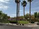 A green community park offers walking paths, trees and grass with a gazebo in the background at 9145 Ebony Threads Ct, Las Vegas, NV 89149