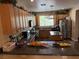 Well-lit kitchen features wood cabinetry, granite countertops, island, and stainless-steel appliances at 9145 Ebony Threads Ct, Las Vegas, NV 89149