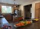 Well-lit kitchen features granite countertops, stainless steel appliances, and a cozy center island at 9145 Ebony Threads Ct, Las Vegas, NV 89149