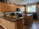 Spacious kitchen featuring wooden cabinets, granite countertops, and stainless steel appliances at 9145 Ebony Threads Ct, Las Vegas, NV 89149
