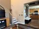 Cozy living room with a staircase and a glimpse into the well-equipped kitchen at 9145 Ebony Threads Ct, Las Vegas, NV 89149