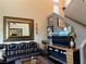 Elegant living room featuring modern furnishings, a staircase, and decorative accents at 9145 Ebony Threads Ct, Las Vegas, NV 89149