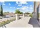 Inviting balcony offers a relaxing outdoor space to enjoy the neighborhood view on a sunny day at 9916 Dusty Winds Ave, Las Vegas, NV 89117