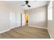 Bedroom featuring closet and neutral wall color with wood-look floors, offering a comfortable and inviting space at 9916 Dusty Winds Ave, Las Vegas, NV 89117